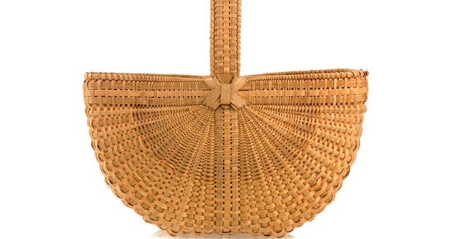 A basket shaped as a half circle with a handle. 