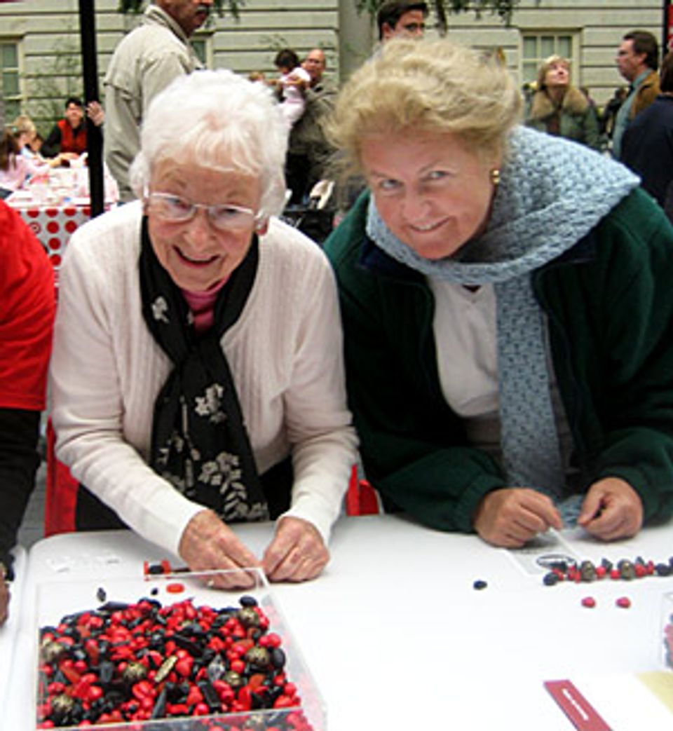 Shirley and Catherine at the Festival's Bead Making Station