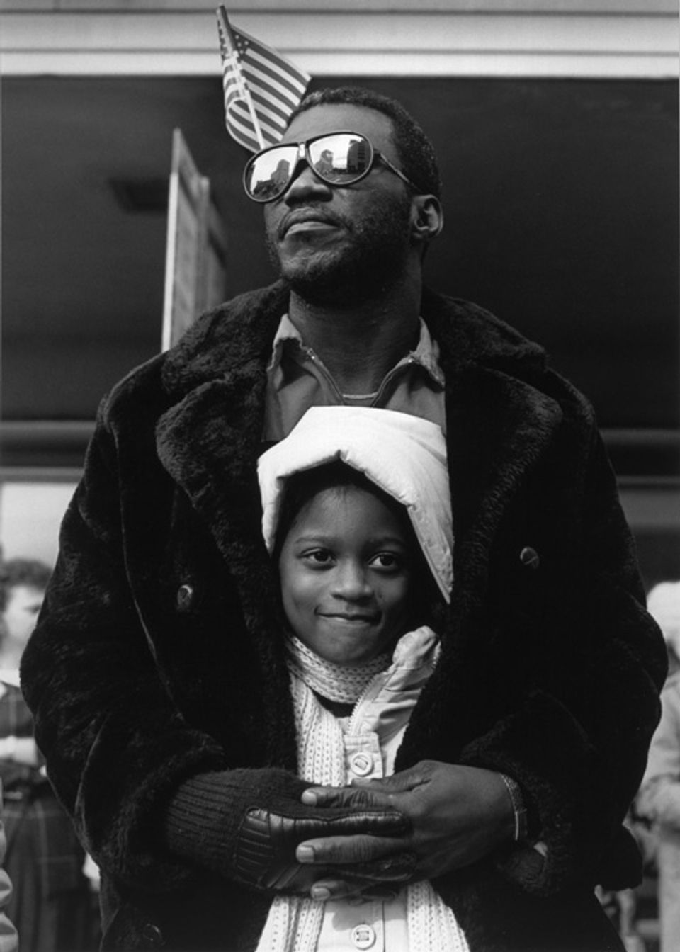 Hudnall's gelatin silver print of a man holding a young girl.