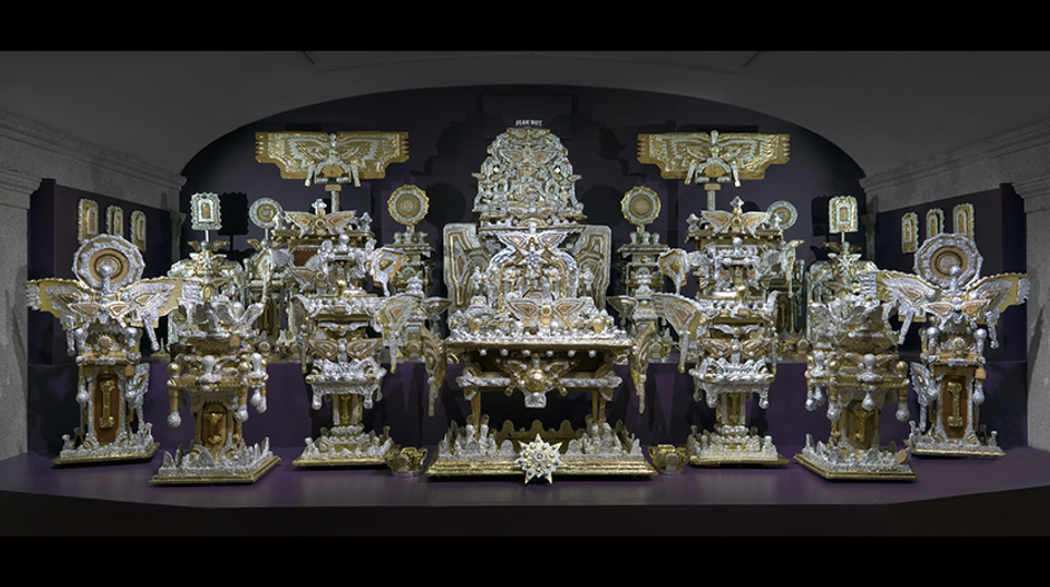 A large-scale throne made of found objects.