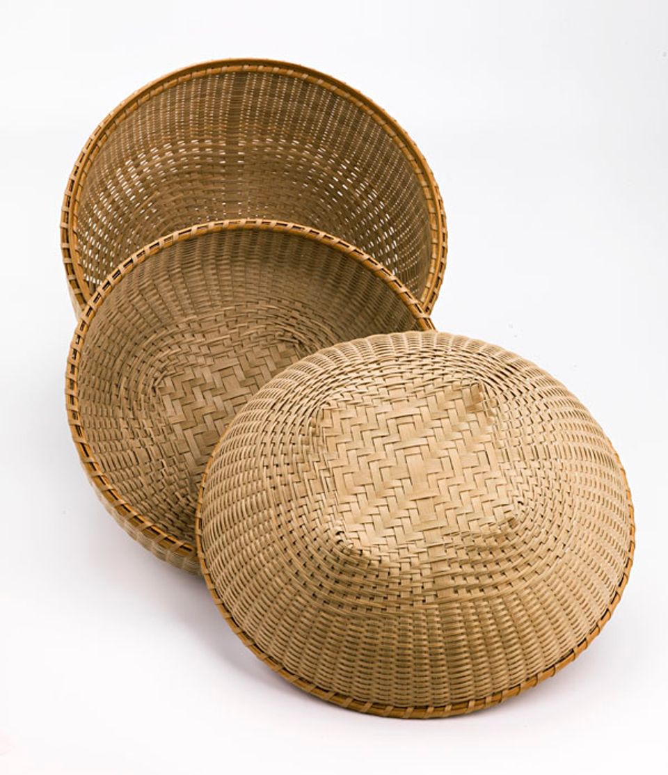 Three baskets that are circular. 