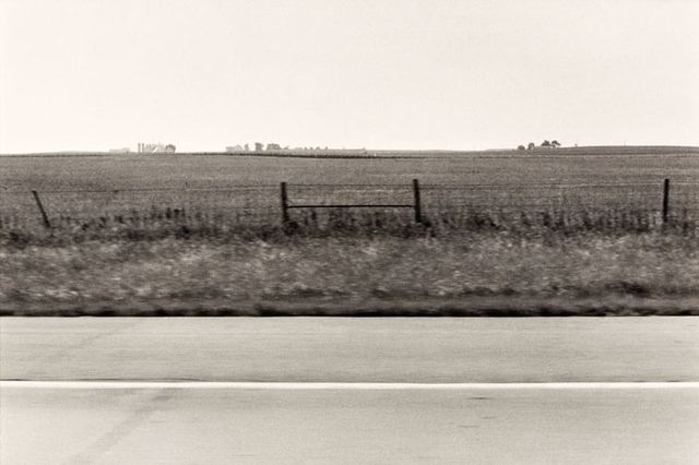 A photograph of a Iowa landscape taken by automobile.