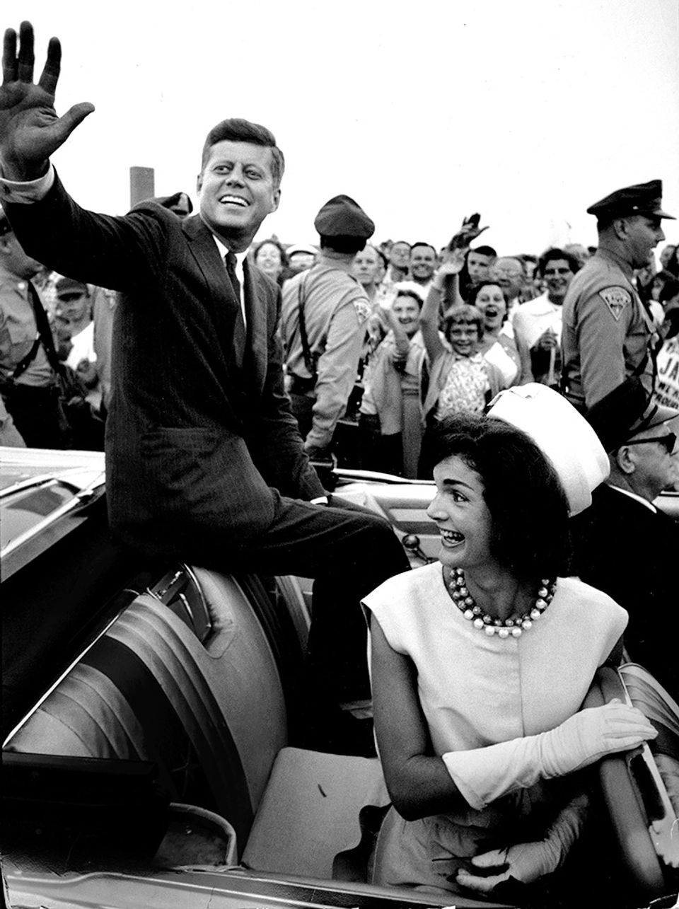 Senator Kennedy waving from car