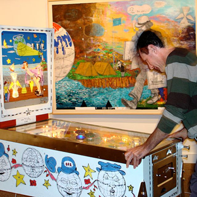 A museum visitor plays William T. Wiley's Punball: Only One Earth