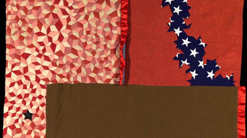 Detail of a mixed media artwork using a flag and military blanket