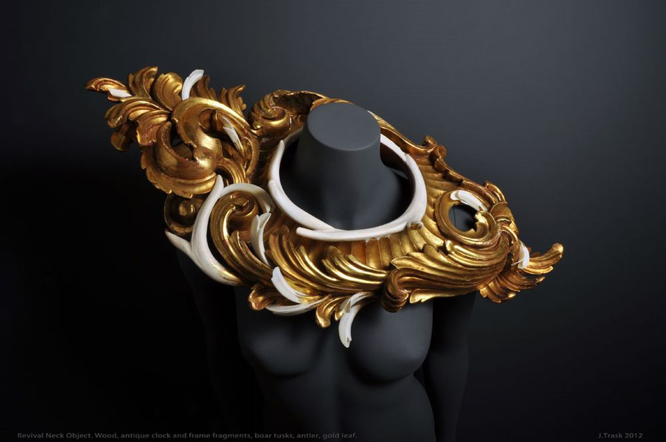 A neckpiece made of antlers and boars' tusks painted gold.