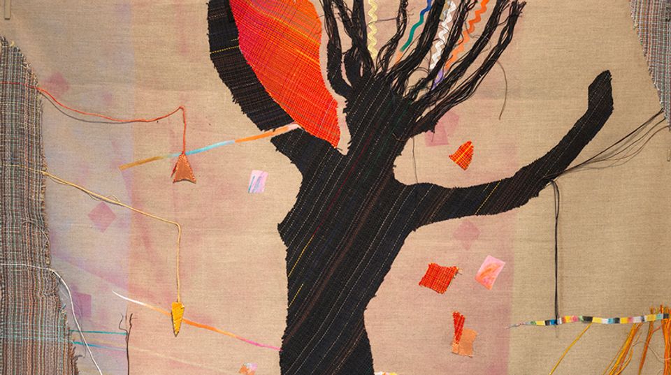 Detail of fiber art with a silhouette of woman. Her arms and one leg are raised as if mid-jump.