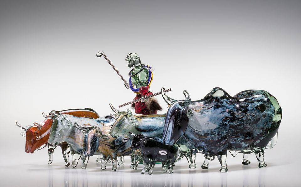 A photograph of a glass artwork with animals