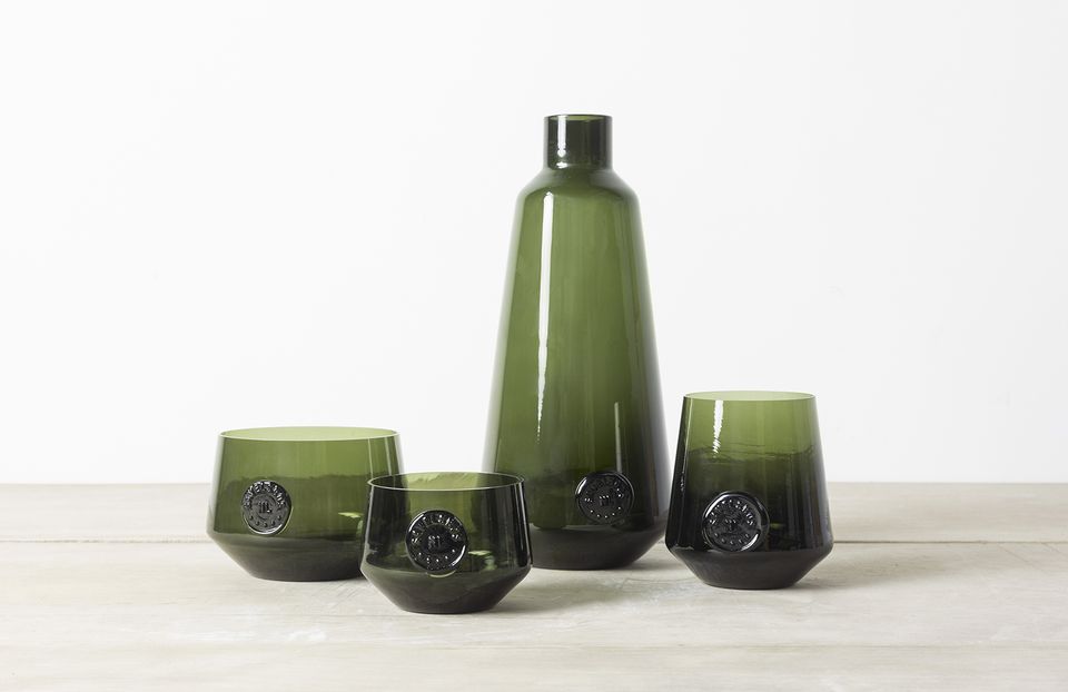 Four green glass objects