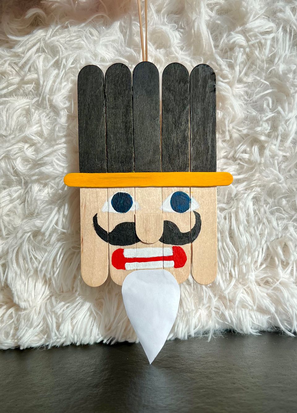 image of nutcracker craft made of popsicle sticks