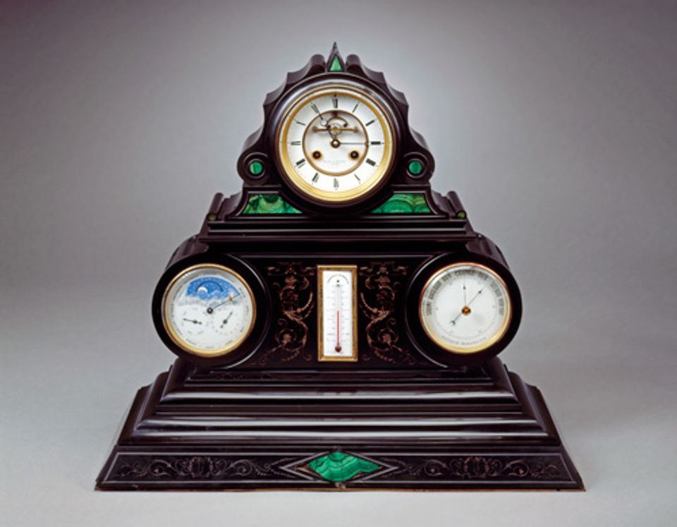 An image of a marble and malachite mantel clock.