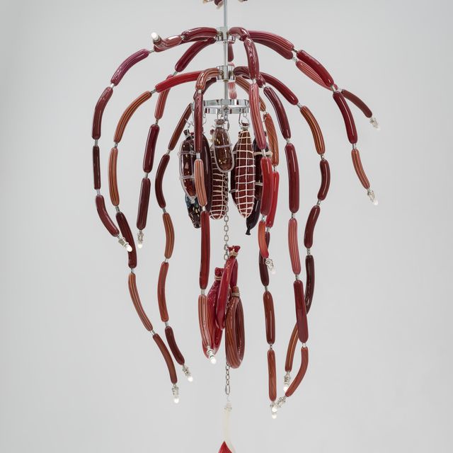 A chandelier made of glass that looks like meat.