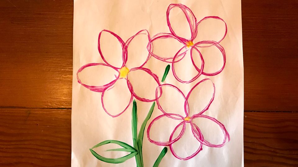 An artwork with a pink flower.