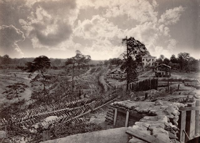 Barnard's vintage albumen print of a town with a few forts and houses.